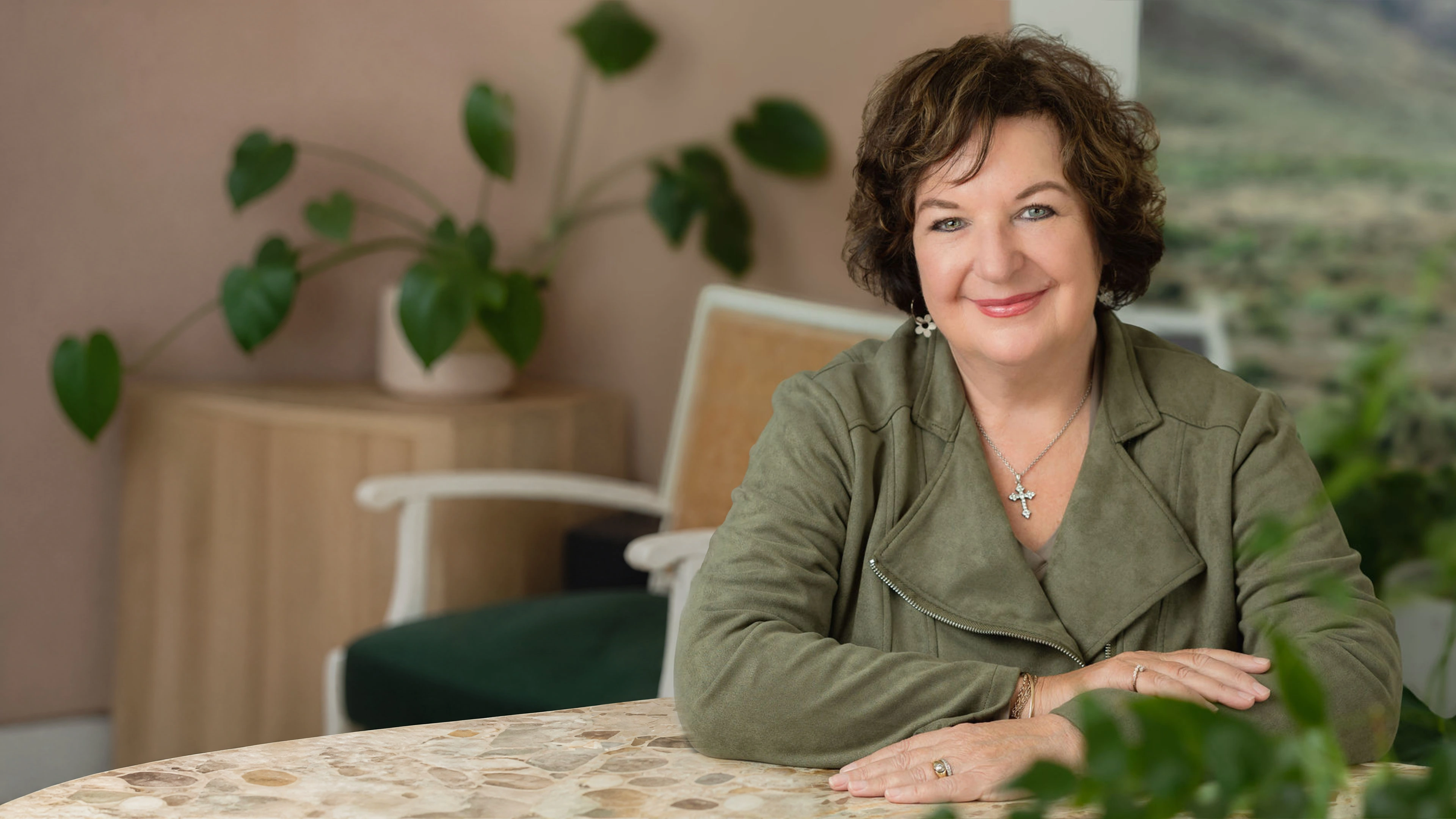 Marlene Lesch smiling while seated at a table